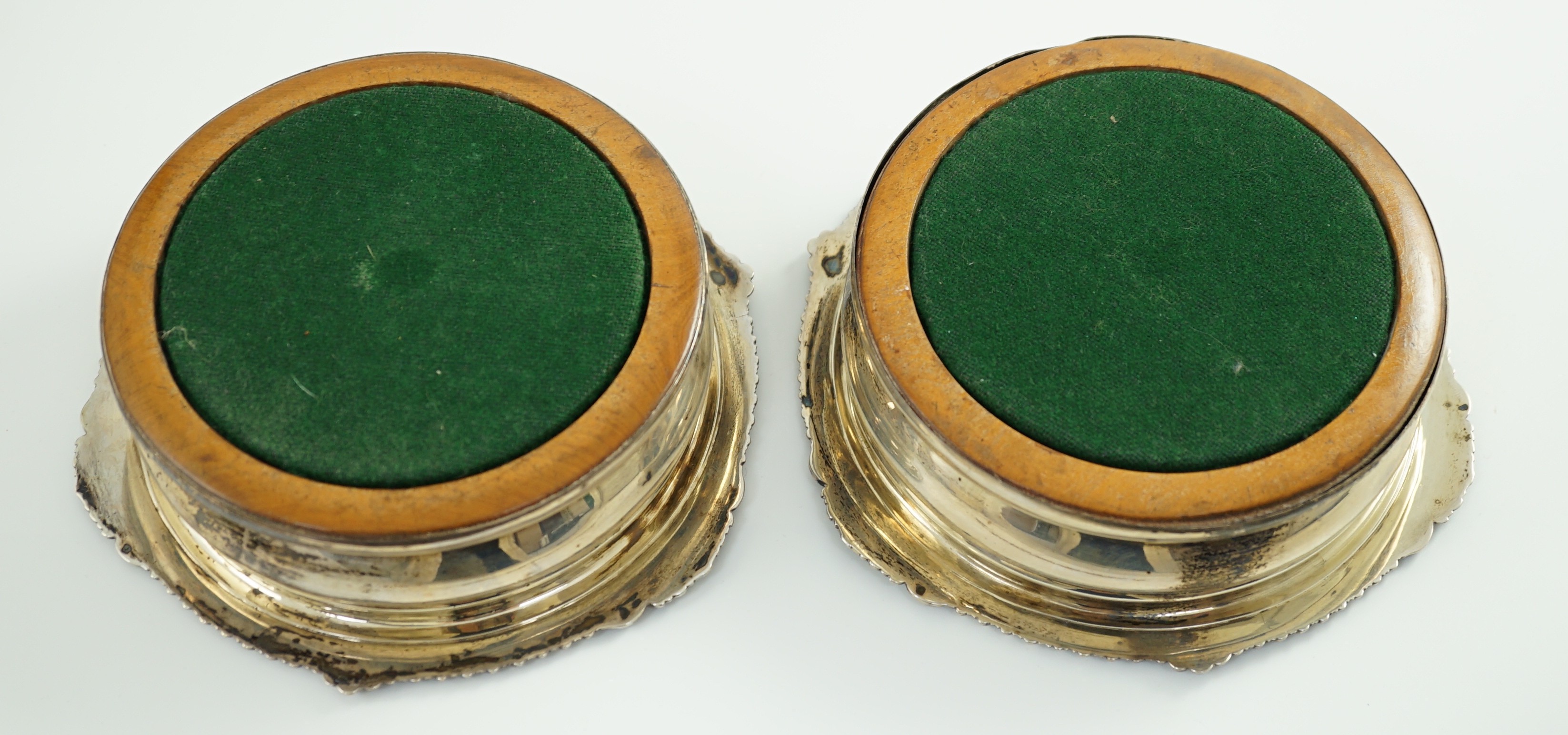 A pair of George IV silver mounted wine coasters by John Walton?